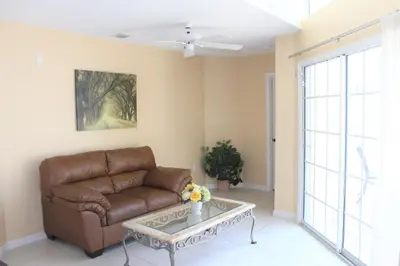 a living room with a couch and a table at Crayson Villa LF811 in Kissimmee