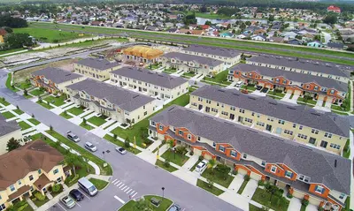 an aerial view of a town with buildings and cars at Four Bedroom Close to Disney 5149A in Kissimmee