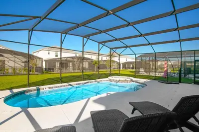 a swimming pool under a tent with chairs at Sonoma Resort 7 Bedroom Home with Pool 1849 in Kissimmee