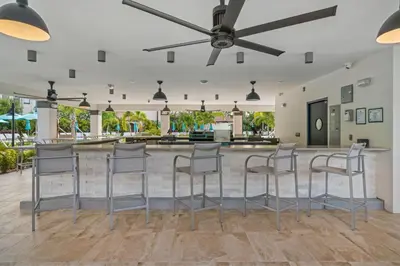 a bar with stools in the middle of a room at Casa Magna Condo #152742 in Orlando