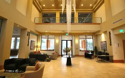 a lobby with couches and chairs in a building at Scarlet in Orlando