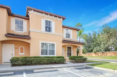a house with a driveway in front of it at Scarlet in Orlando