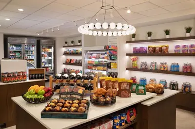 a grocery store with fruits and vegetables on a counter at DoubleTree Suites by Hilton Orlando at Disney Springs in Orlando