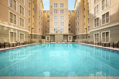 a large swimming pool in the middle of a building at Homewood Suites by Hilton Orlando-International Drive Convention Center in Orlando