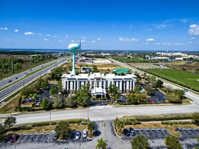 an aerial view of a building with a water tower at Hampton Inn & Suites Clermont in Clermont
