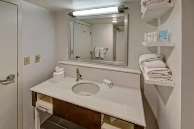 a bathroom with a sink and a mirror at Hampton Inn & Suites Clermont in Clermont