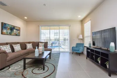 a living room with a couch and a tv at Silver Creek - 3 Bed Townhouse Wsplashpool-5003Sc in Orlando