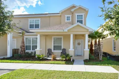a house with chairs in front of it at Silver Creek - 3 Bed Townhouse Wsplashpool-5003Sc in Orlando