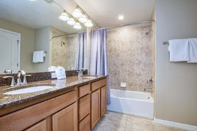a bathroom with a sink and a tub and a shower at Paradise Palms-4 Bed Townhome W-Splashpool-3044Ppr in Kissimmee