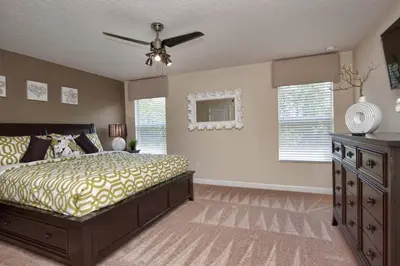 a bedroom with a bed and a ceiling fan at Paradise Palms- 6 Bedroom Pool Home-3150Pp in Kissimmee