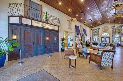a lobby of a hotel with chairs and tables at Paradise Palms- 6 Bedroom Pool Home-3150Pp in Kissimmee