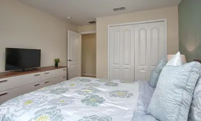 a bedroom with a bed with a tv on it at Dog-Friendly Townhome Wsplashpool -3201Pp in Kissimmee