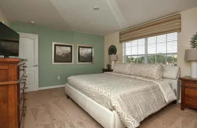 a bedroom with a large bed and a window at Dog-Friendly Townhome Wsplashpool -3201Pp in Kissimmee