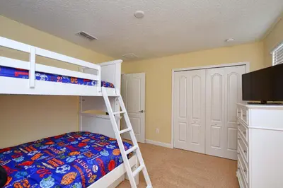 a bedroom with two bunk beds and a television at Very Private Pool & Spa, Spacious, Wifi - 3507Pp in Kissimmee