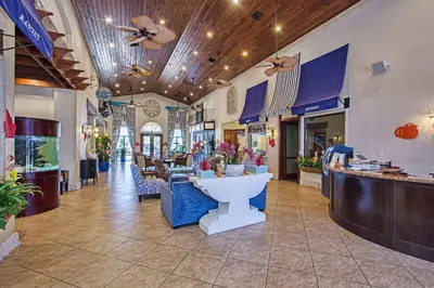 a store lobby with a counter with flowers in it at Very Private Pool & Spa, Spacious, Wifi - 3507Pp in Kissimmee