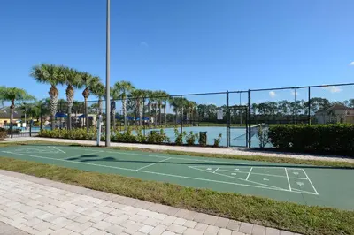 a tennis court in front of a tennis court at House Wpool And Jacuzzi In Paradise Palms-3151Pp in Kissimmee
