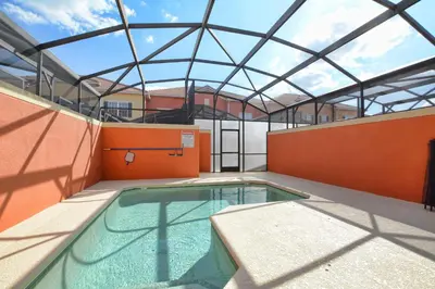 a swimming pool in a building with a glass roof at Paradise Palms-4 Bed Townhome W-Splashpool-3035Pp in Kissimmee