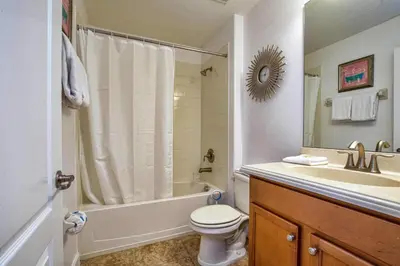 a bathroom with a toilet and a shower and a sink at Conservation View, Resort, Pool Home-3116Pp in Kissimmee