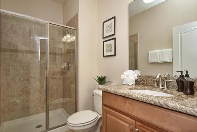 a bathroom with a shower and a toilet and a sink at Dog Friendly Townhome W Splashpool-3202Pp in Kissimmee