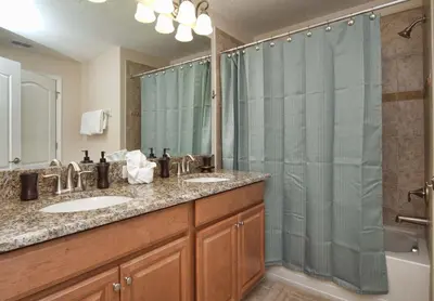 a bathroom with two sinks and a shower at Dog Friendly Townhome W Splashpool-3202Pp in Kissimmee