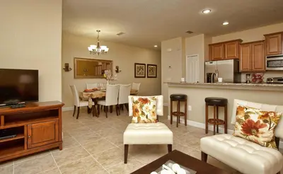 a living room with a kitchen and a dining room at Dog Friendly Townhome W Splashpool-3202Pp in Kissimmee