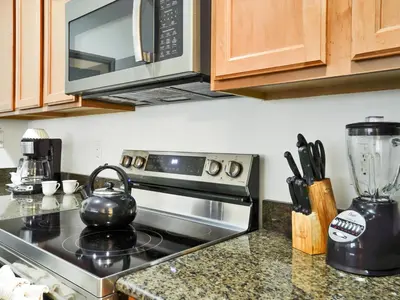 a kitchen counter with a stove and a microwave at Close To Clubhouse, Splashpool-3026Pp in Kissimmee