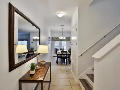 a hallway with a mirror and a dining room at Close To Clubhouse, Splashpool-3026Pp in Kissimmee