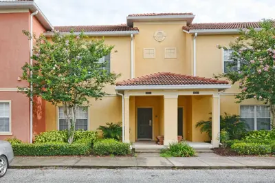 a yellow house with a red roof at Bright & Cheery Decor, Townhome Wspashpool-3015Pp in Kissimmee
