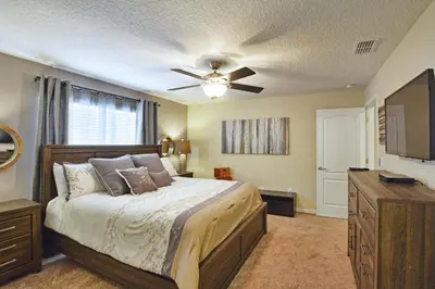 a bedroom with a bed and a ceiling fan at Paradise Palms-4 Bed Townhouse Wsplashpool3622Ppr in Kissimmee