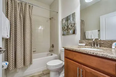 a bathroom with a toilet and a sink and a shower at Across From Clubhouse, Private PoolSpa-1651Str in Kissimmee