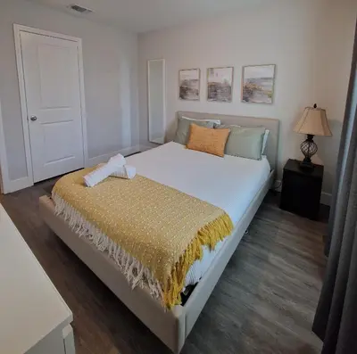 a bedroom with a large white bed in a room at Home Away From Home in Kissimmee