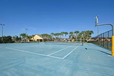 a tennis court with a net on top of it at South Facing Pool Wsplashpool- 3080Pp in Kissimmee