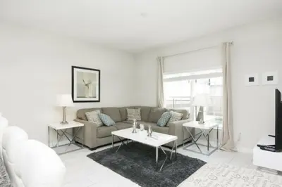 a living room with a couch and two tables at Perfect Townhome for your Vacation with Private Pool SL4807 in Kissimmee
