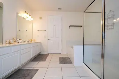 a bathroom with a shower and a sink and a mirror at Wonderful Apt Convention Center VistaCay VC50253 in Orlando
