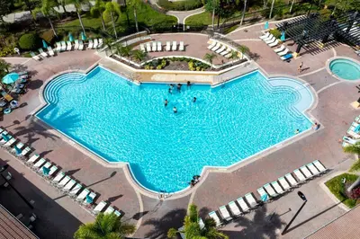 an overhead view of a large swimming pool with lounge chairs at Wonderful Apt Convention Center VistaCay VC50253 in Orlando