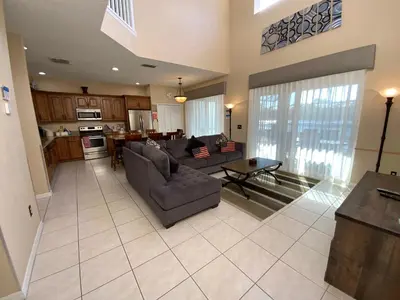 a living room with a couch and a table at The Villa at Terra Verde in Kissimmee