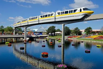 a train on a bridge over a body of water at Holiday Inn & Suites Orlando - I-Drive - Theme Parks by IHG in Orlando