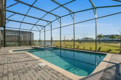 an indoor swimming pool with a glass roof at 2901FS - Amazing 8 bedroom at Storey Lake in Kissimmee