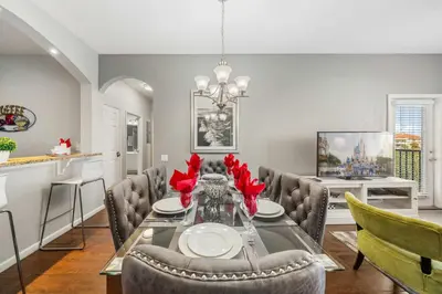 a dining room with a table and chairs at Deluxe 3 Bedroom Apartment 404 in Orlando