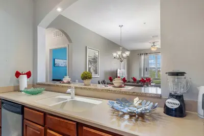a kitchen with a sink and a counter top at Deluxe 3 Bedroom Apartment 404 in Orlando