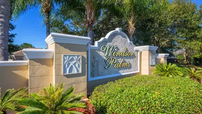 a sign for the walt disney palms resort at Minnies Townhouse in Windsor Palms Resort in Kissimmee