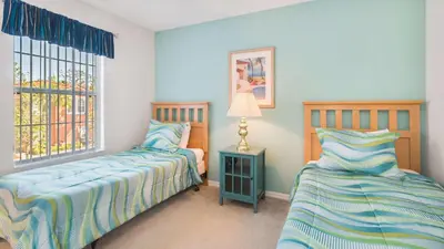 a bedroom with two beds and a window at Bikini on the Beach at Terra Verde Resort in Kissimmee