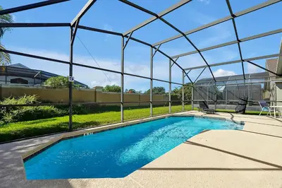 a swimming pool under a tent with a swimming pool at Bikini Bottom - 4 bed Disney pool home in Kissimmee