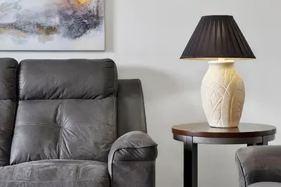 a lamp sitting on a table next to a chair at Bikini Bottom - 4 bed Disney pool home in Kissimmee