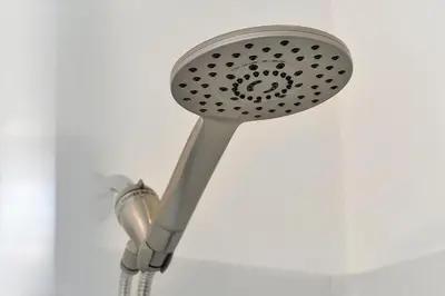 a shower head on a white wall at Bikini Bottom - 4 bed Disney pool home in Kissimmee