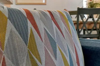 a colorful blanket on the back of a couch at Castaway Getaway - Very popular 4 bed family pool home on Terra Verde Resort - close to Disney World in Kissimmee