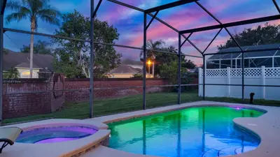 a swimming pool in the backyard of a house at Disney Backstage Villa - Stay in this popular 4 bed pool home that's very close to Disney in Orlando