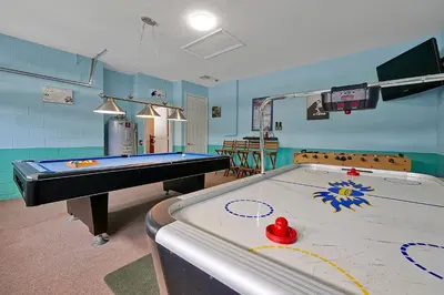 a room with a pool table in a room at Disney Magic Vacation - A fabulous 4 bed family pool home on Windsor Palms Resort - close to Disney World in Kissimmee