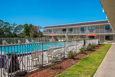 a swimming pool in front of a building at Rodeway Inn Kissimmee - Orlando Maingate West - Free Theme Park Shuttle in Orlando