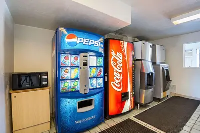 a pepsi machine next to a soda machine at Rodeway Inn Kissimmee - Orlando Maingate West - Free Theme Park Shuttle in Orlando